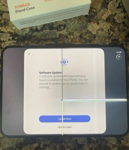 Real iPhone Duo with a damaged inner display and bright lines extending from the center fold