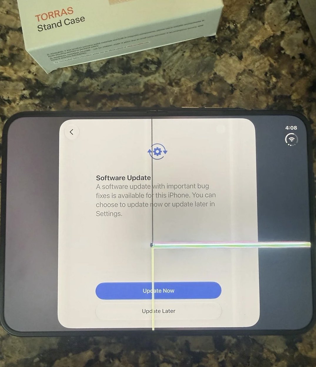 Real iPhone Duo with a damaged inner display and bright lines extending from the center fold